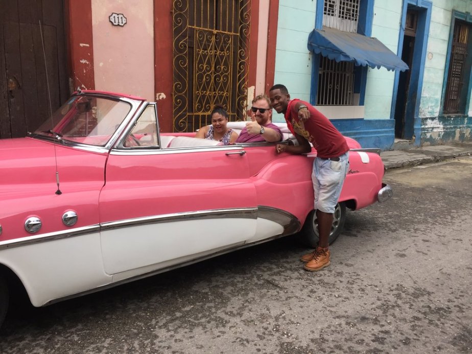  I'm a sucker for a classic car in hot pink! Our guide introduced Drew and I to the local escuela community, and Havana's deep ties to artistic Afro-Cuban expression and Santeria. 